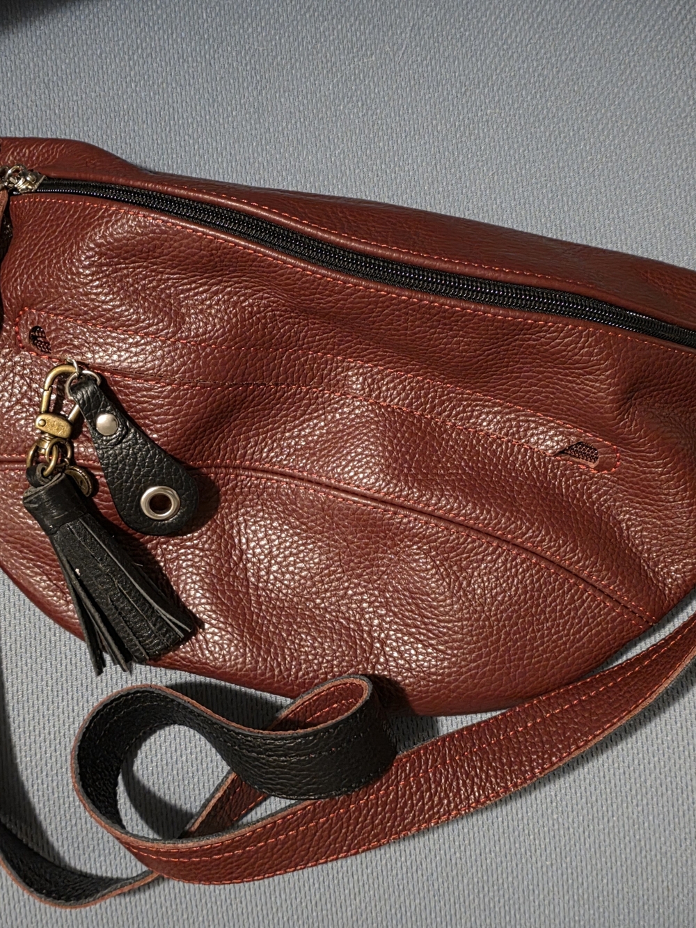 Wine Red Leather Crossbody Bag with Black Tassel.
